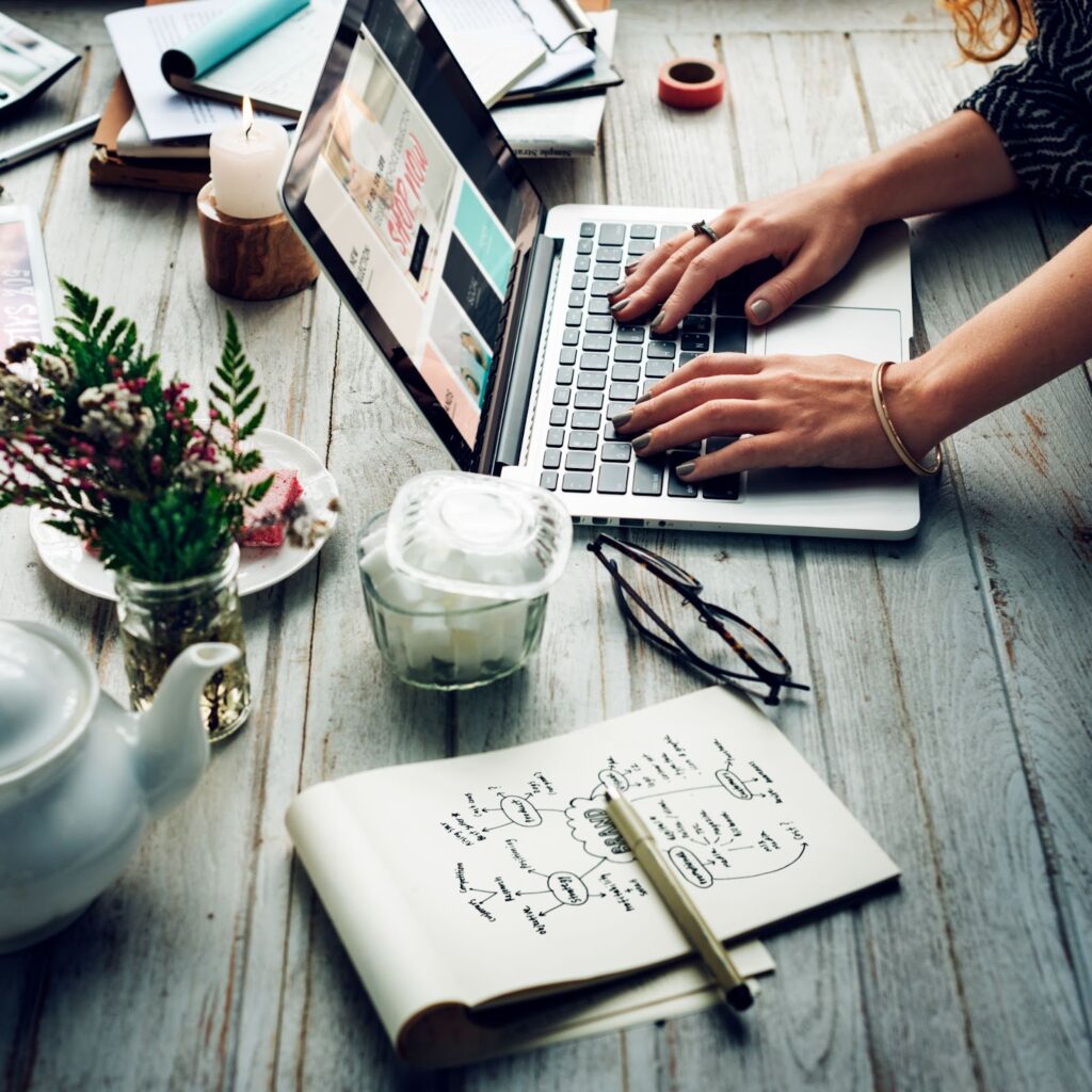 Side view of woman using laptop