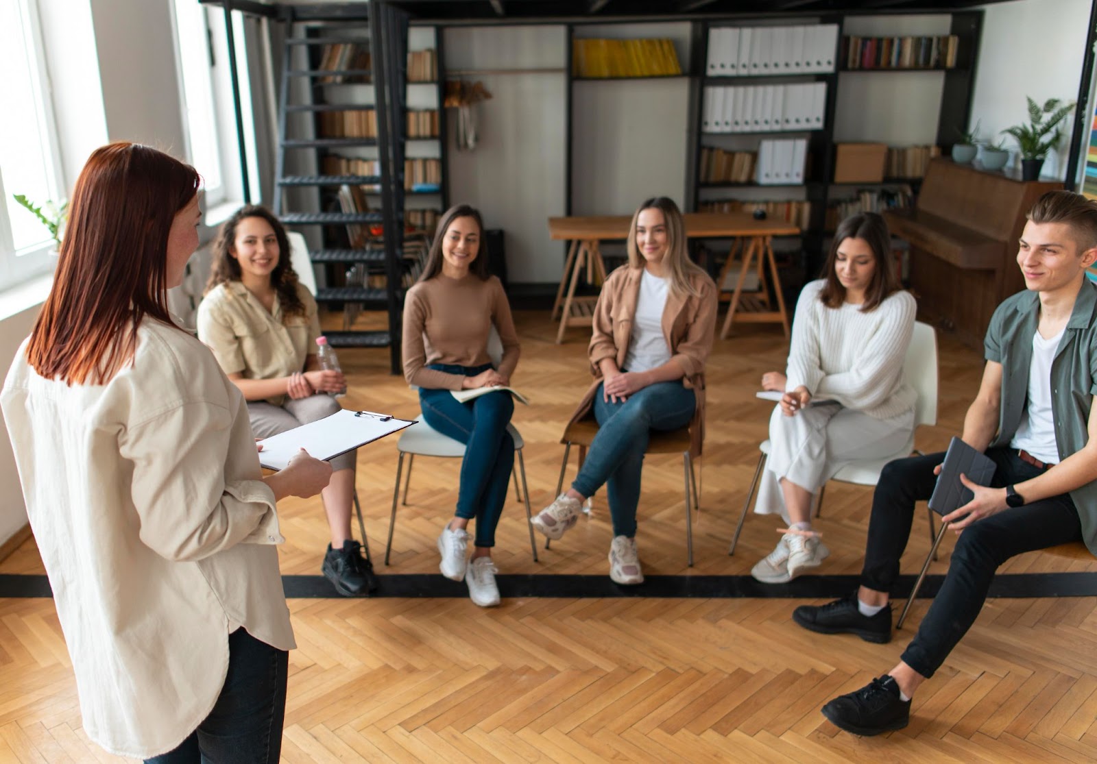 People sitting on chairs during the meeting